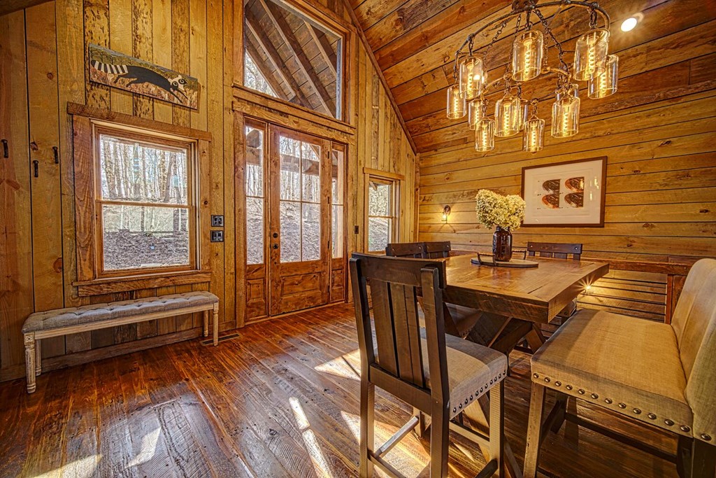 111 Price Circle Blue Ridge, GA 30513 - Photo 28 of 66 a view of a dining room with furniture window and wooden floor