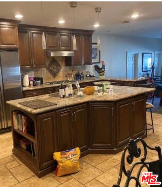 4205 Eve Road Simi Valley, CA 93063 - Photo 3 of 8 a kitchen with stainless steel appliances granite countertop a stove a sink and a refrigerator