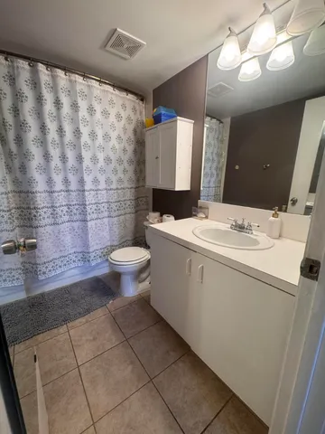 a bathroom with a sink and toilet
