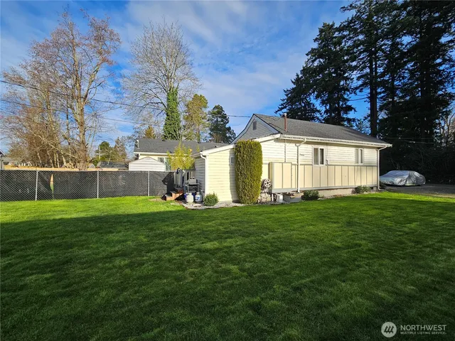 a front view of a house with parking space