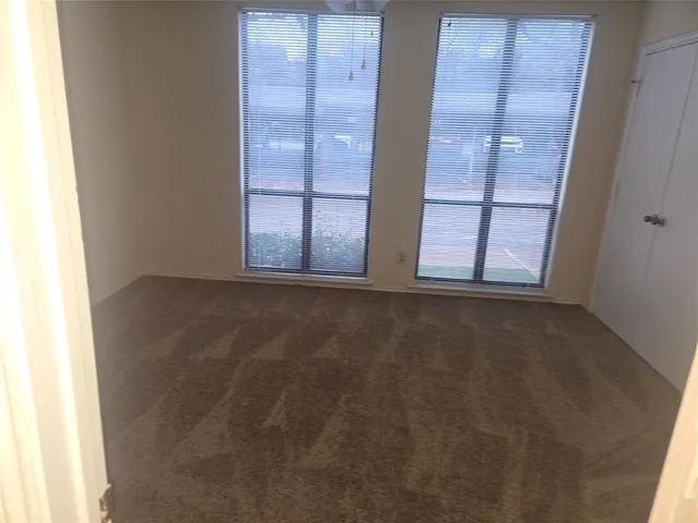 a bathroom with a granite countertop sink a toilet and bathtub