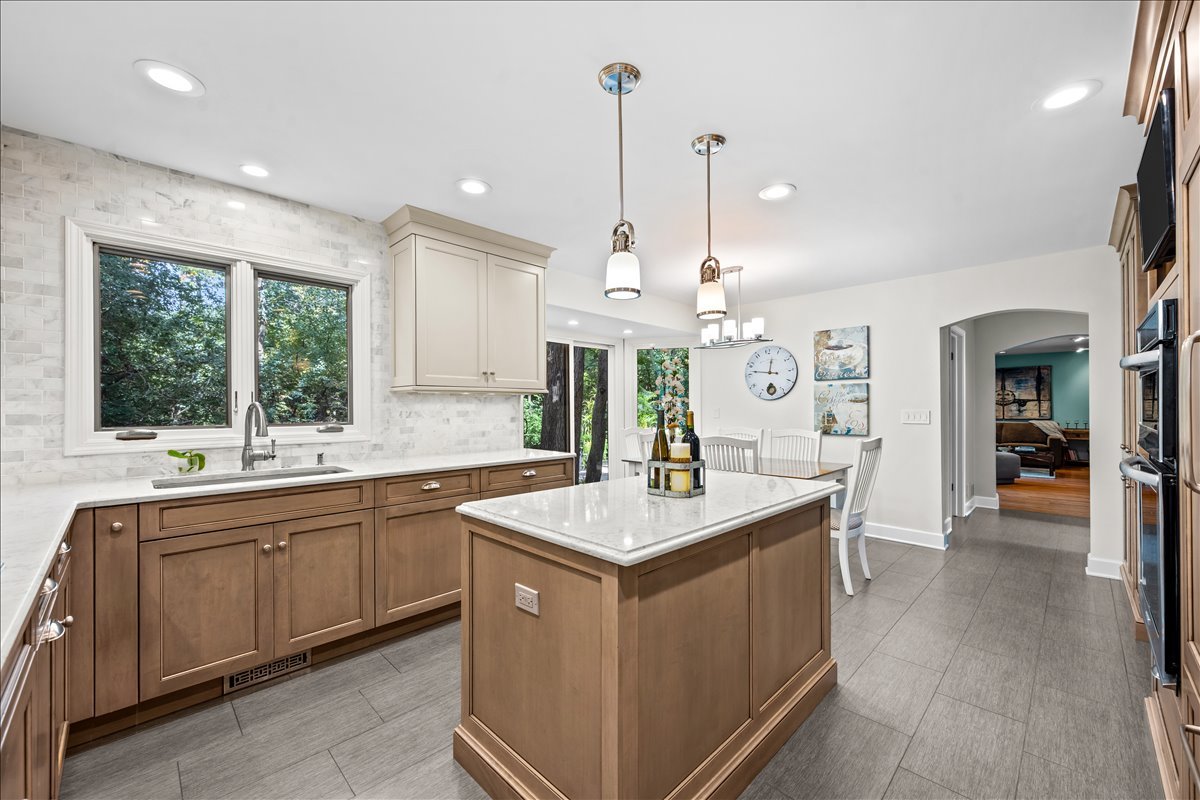 1985 Clavey Road Highland Park, IL 60035 - Photo 11 of 35 a kitchen with a sink stove and wooden floor