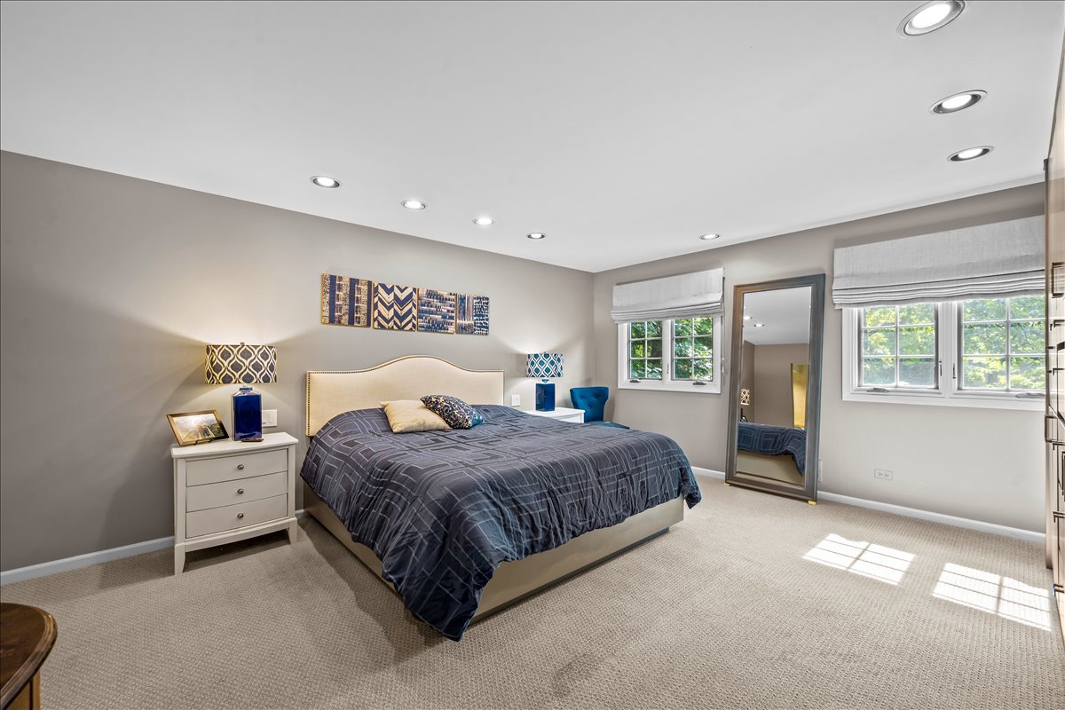 1985 Clavey Road Highland Park, IL 60035 - Photo 16 of 35 a bedroom with a bed and large windows