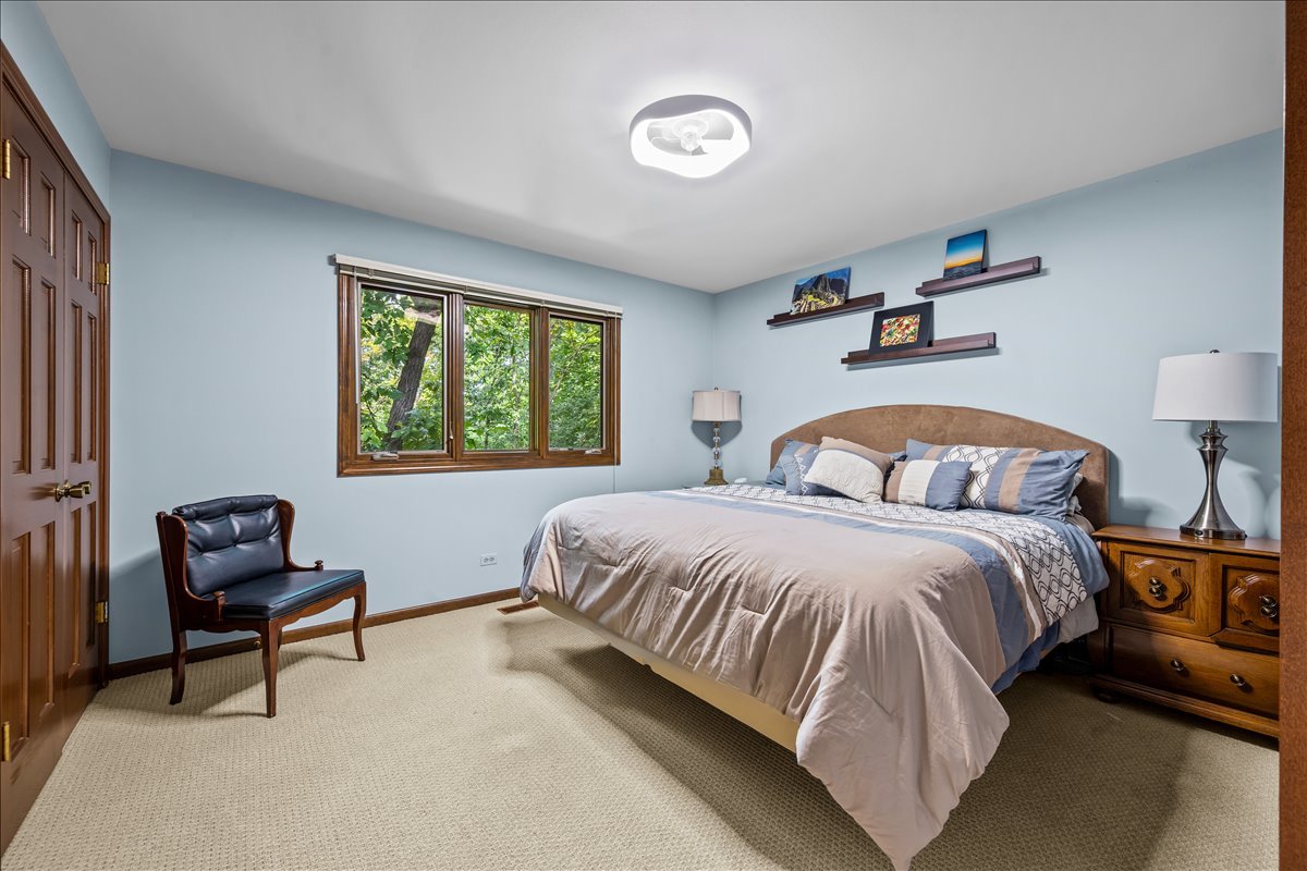 1985 Clavey Road Highland Park, IL 60035 - Photo 19 of 35 a bedroom with a bed and a window