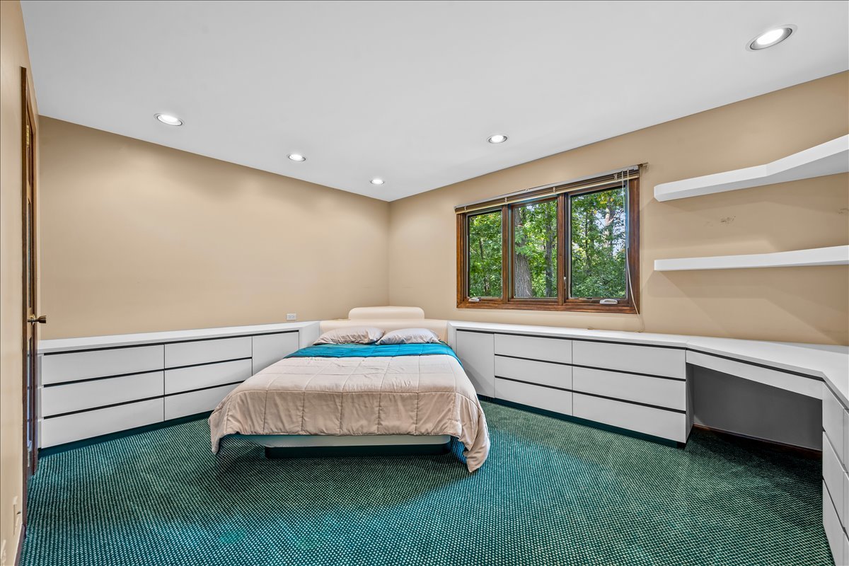 1985 Clavey Road Highland Park, IL 60035 - Photo 21 of 35 a bedroom with a bed and a window