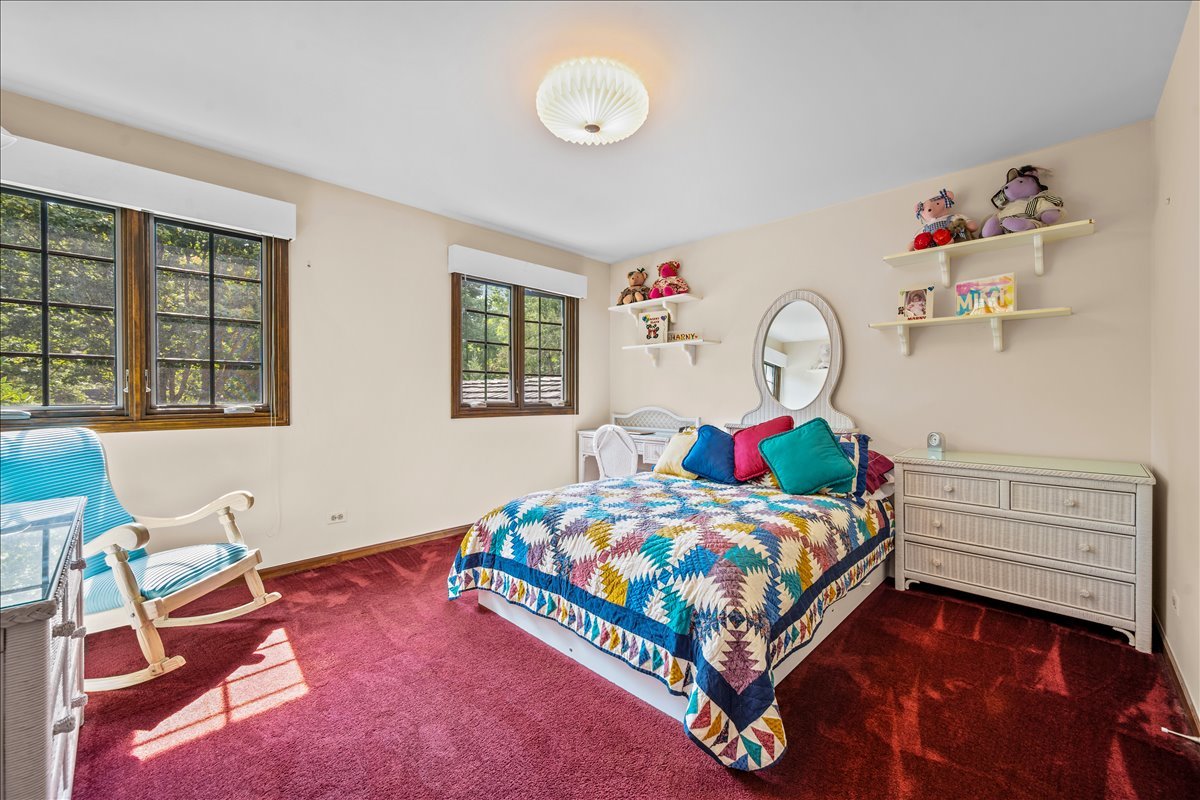 1985 Clavey Road Highland Park, IL 60035 - Photo 22 of 35 a bedroom with a bed and window