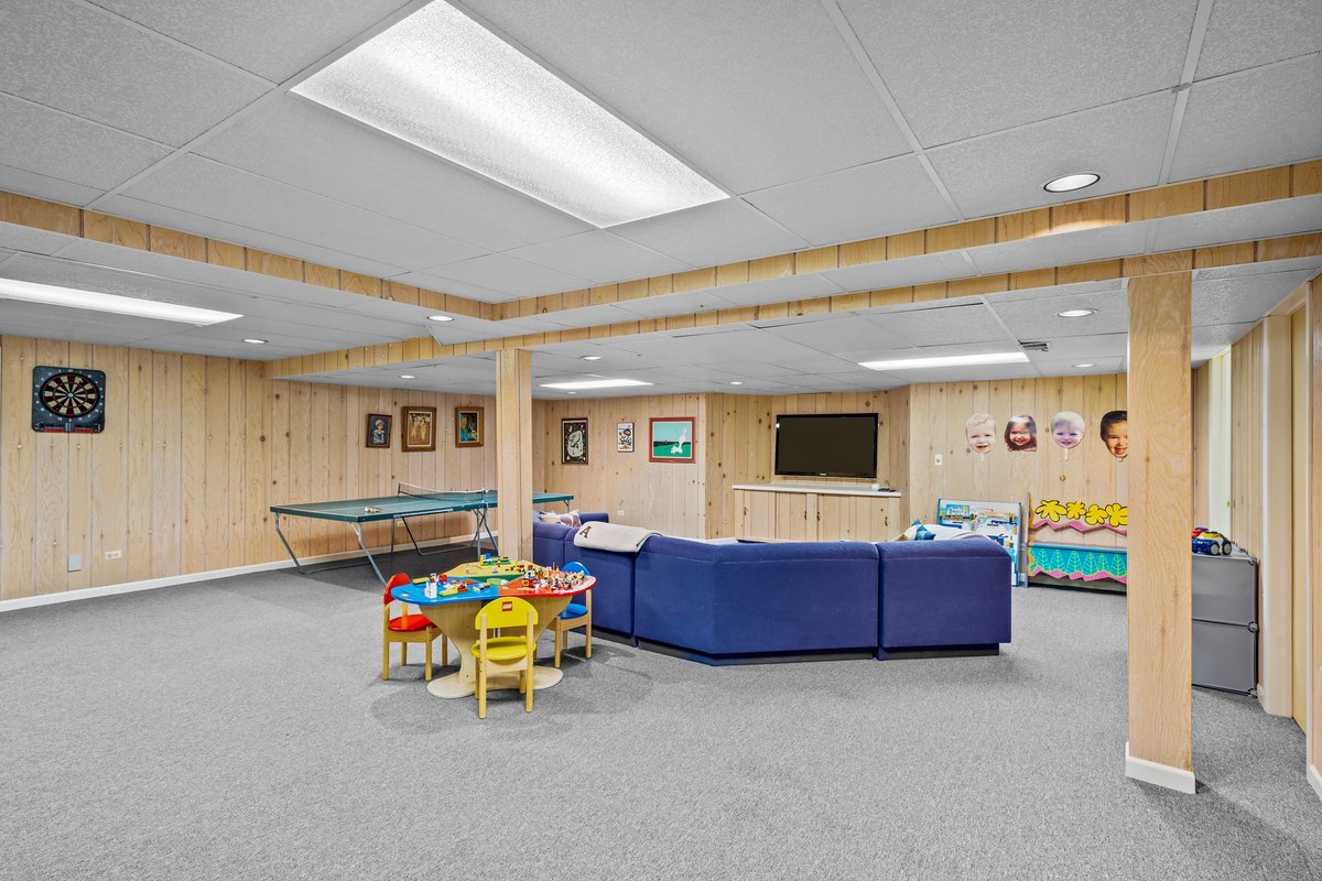 1985 Clavey Road Highland Park, IL 60035 - Photo 23 of 35 a living room with furniture and a flat screen tv