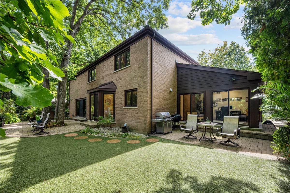 1985 Clavey Road Highland Park, IL 60035 - Photo 31 of 35 a view of a house with backyard sitting area and garden
