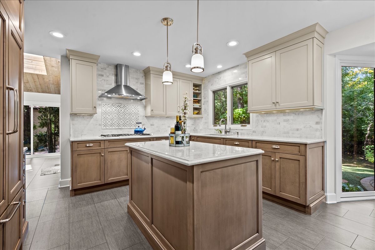 1985 Clavey Road Highland Park, IL 60035 - Photo 10 of 35 a kitchen with kitchen island granite countertop a sink appliances and cabinets