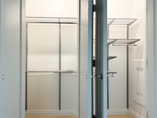 a bathroom with a glass shower door