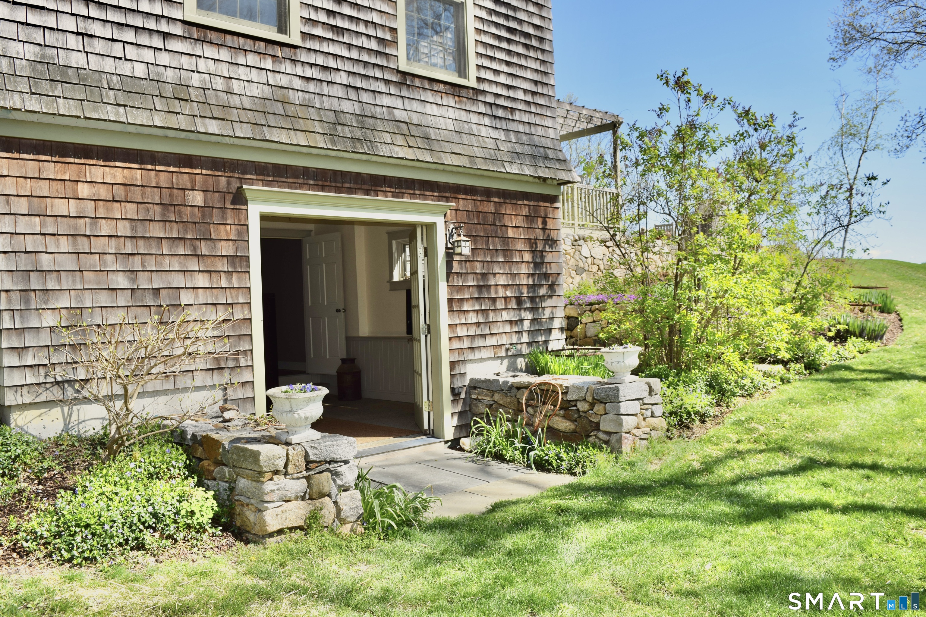 56 Gold Mine Road Roxbury, CT 06783 - Photo 29 of 40 Basement level walkout leading to outdoor shower and terrace.