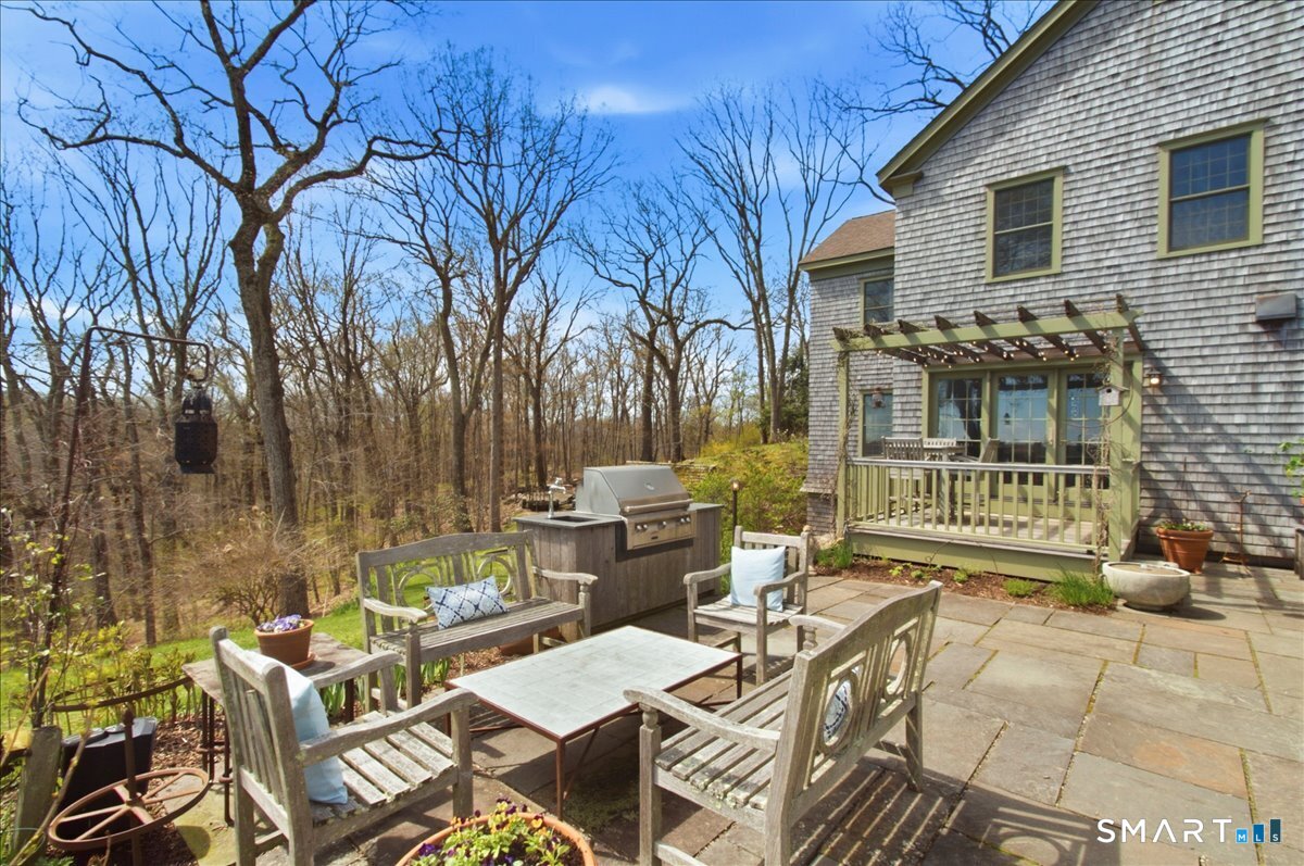 56 Gold Mine Road Roxbury, CT 06783 - Photo 32 of 40 Stone patio with built-in grill that has sink with running water.