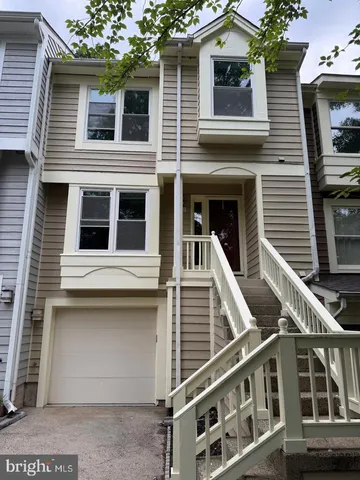 a view of a house with more windows and brick wall