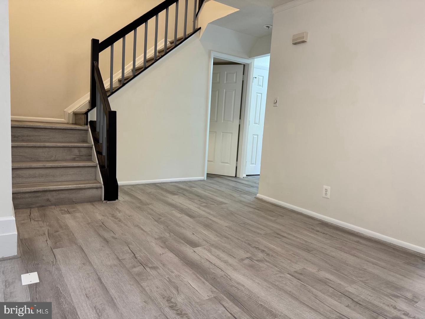1631 Oak Spring Way Reston, VA 20190 - Photo 5 of 10 a view of entryway with wooden floor and stairs