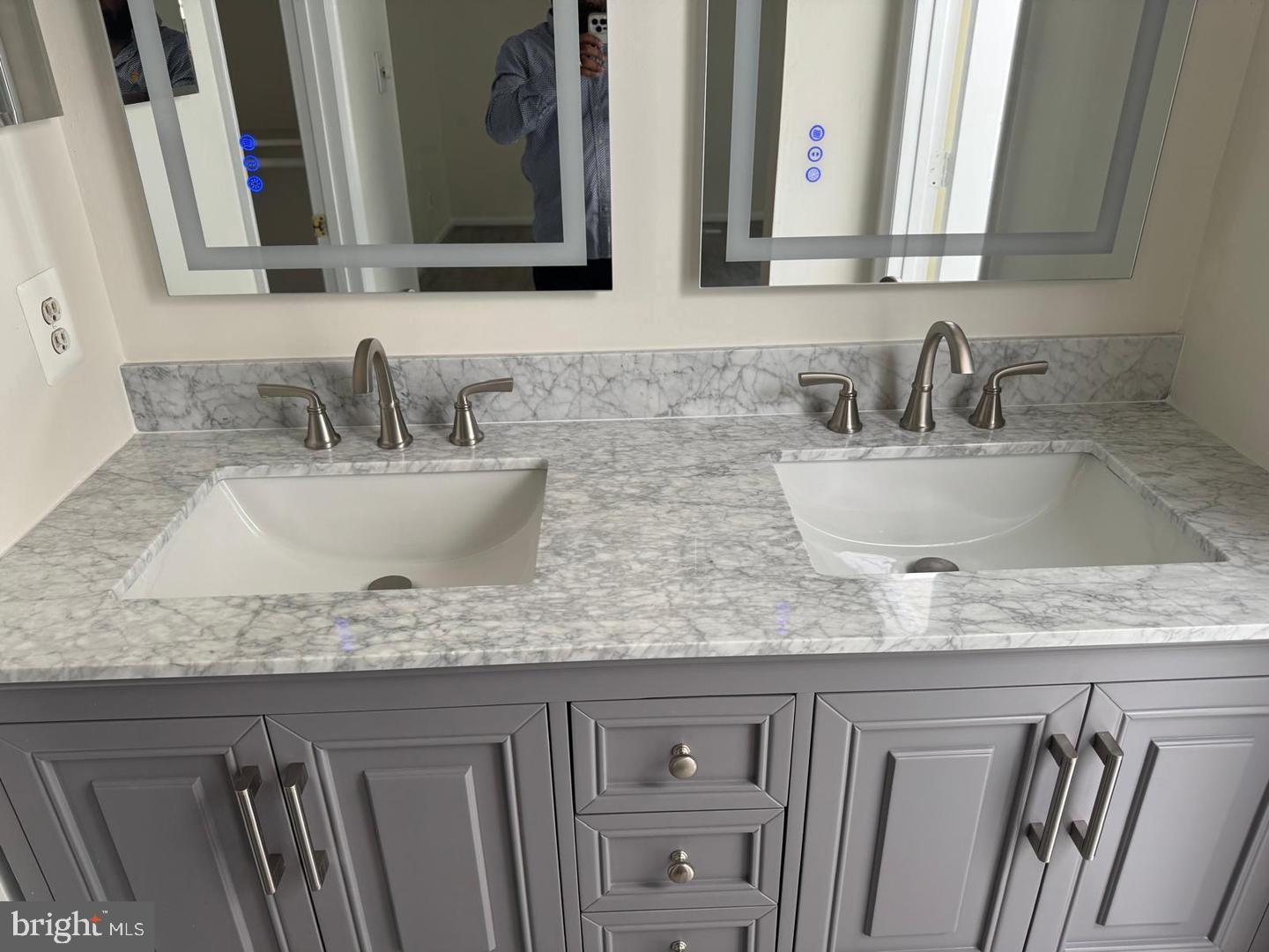 1631 Oak Spring Way Reston, VA 20190 - Photo 9 of 10 a bathroom with kitchen island granite countertop a sink and a white cabinets