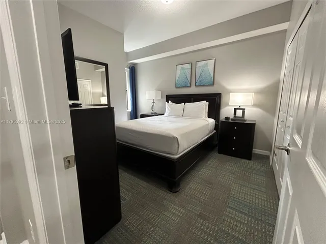 a bedroom with a bed and a walk in closet