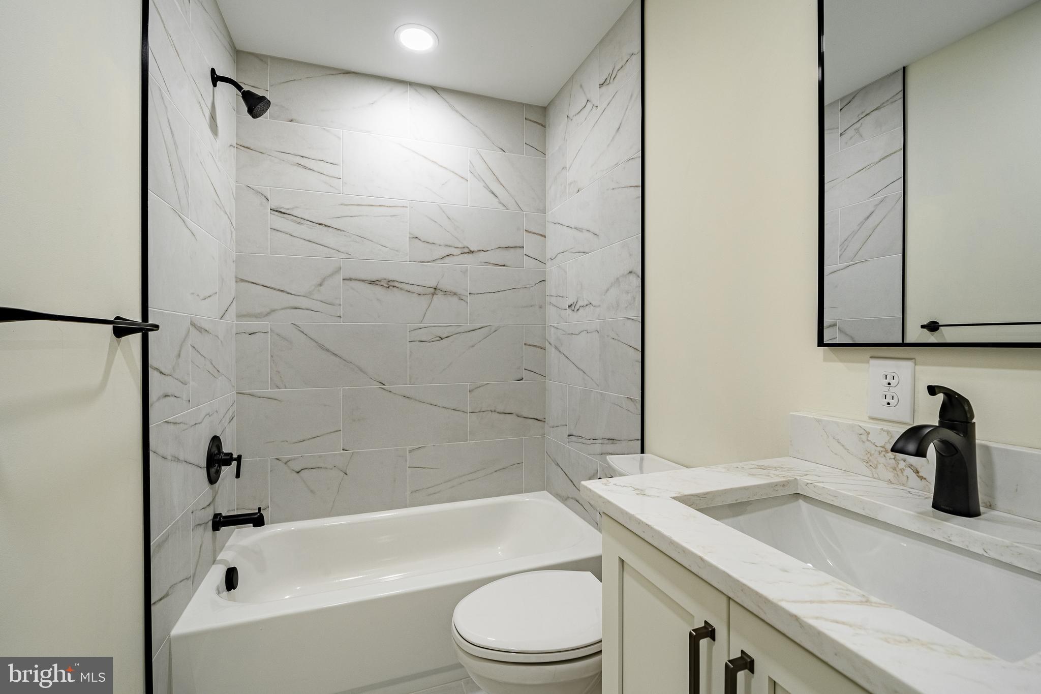 231 Laurel Bridge Road Landenberg, PA 19350 - Photo 16 of 57 a bathroom with a sink a toilet and shower