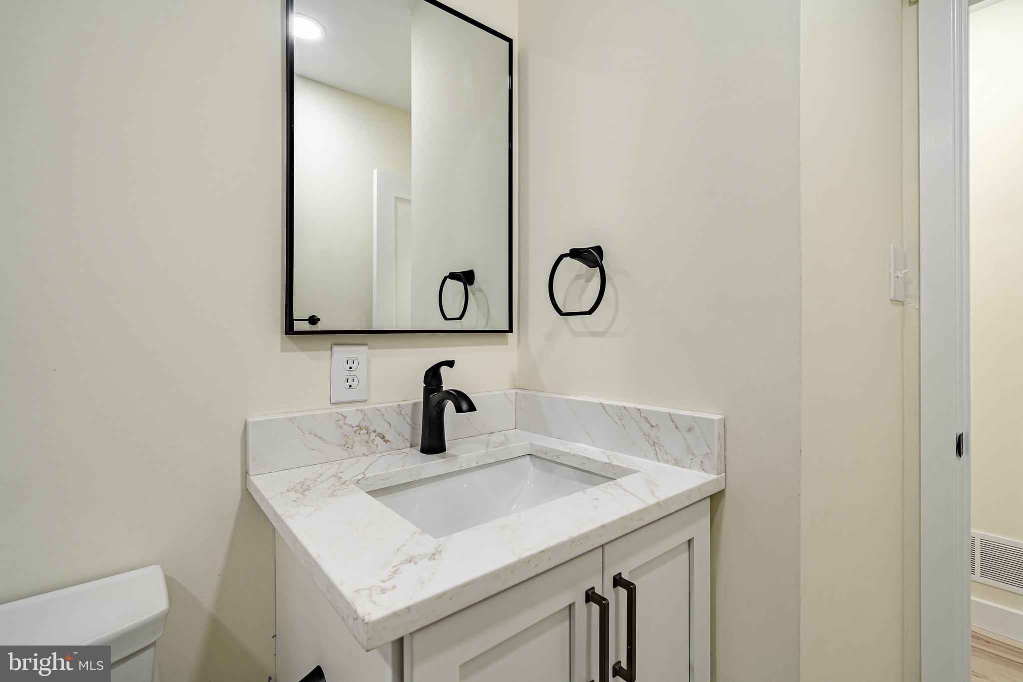 231 Laurel Bridge Road Landenberg, PA 19350 - Photo 18 of 57 a bathroom with a sink and a mirror