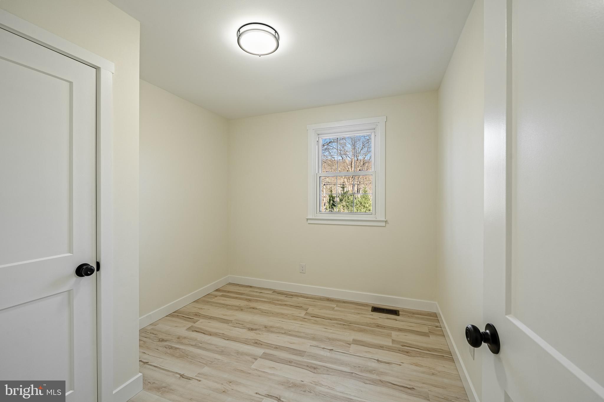 231 Laurel Bridge Road Landenberg, PA 19350 - Photo 21 of 57 a view of a room with wooden floor and closet
