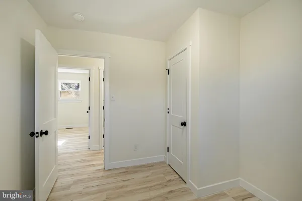 a view of room with stairs and white walls
