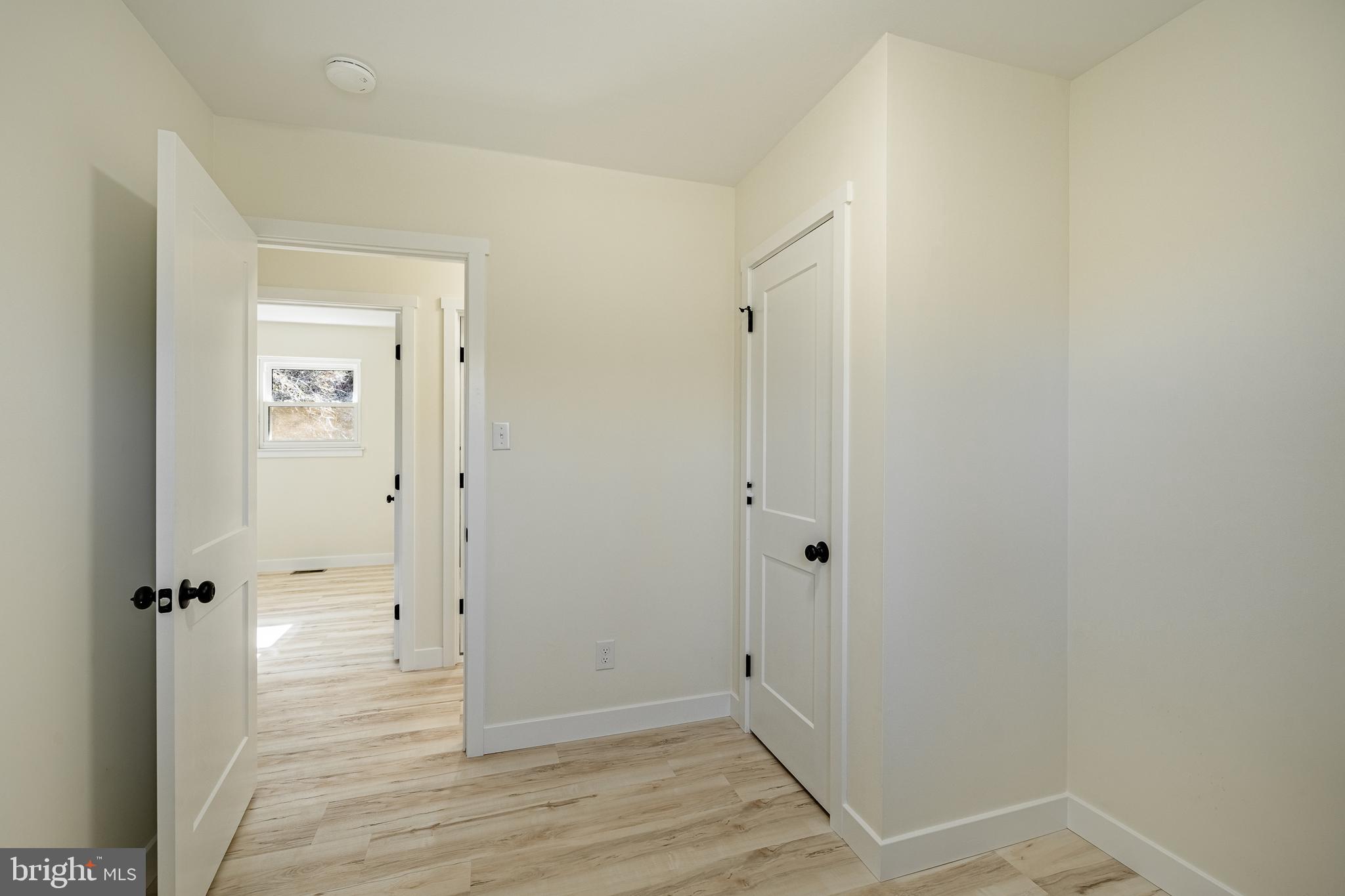 231 Laurel Bridge Road Landenberg, PA 19350 - Photo 22 of 57 an empty room with wooden floor