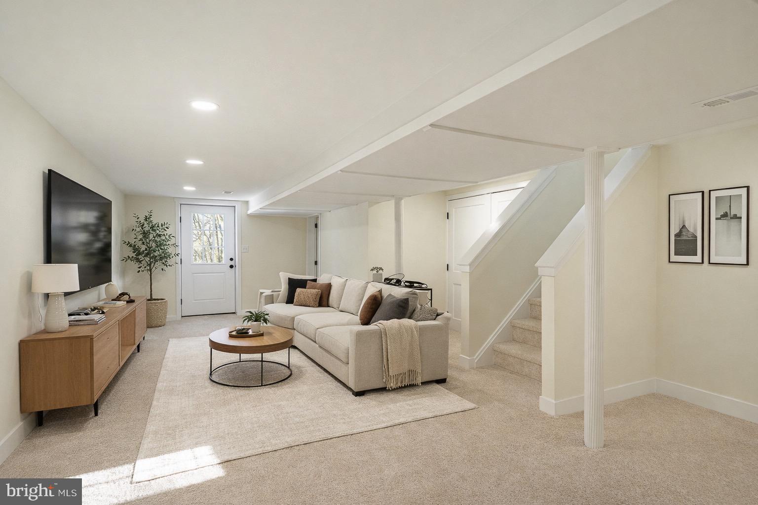231 Laurel Bridge Road Landenberg, PA 19350 - Photo 23 of 57 a living room with furniture and a flat screen tv