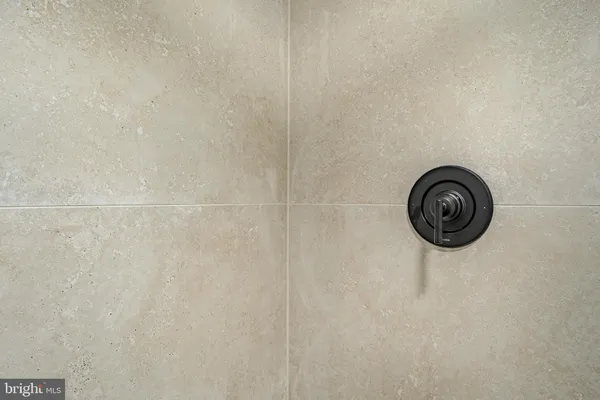 a view of a house with a large window and a yard