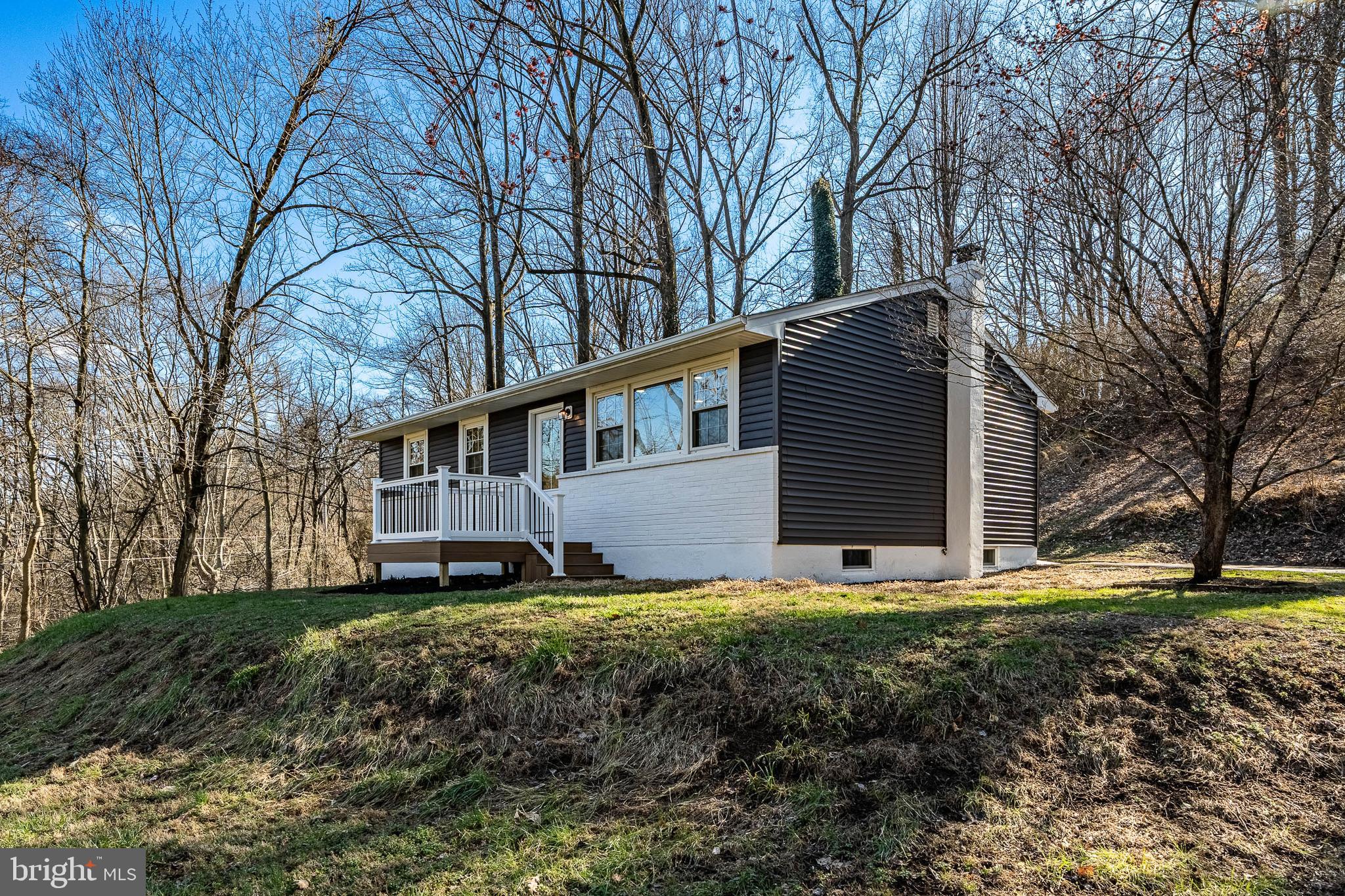 231 Laurel Bridge Road Landenberg, PA 19350 - Photo 36 of 57 a view of a house with a large window and a yard