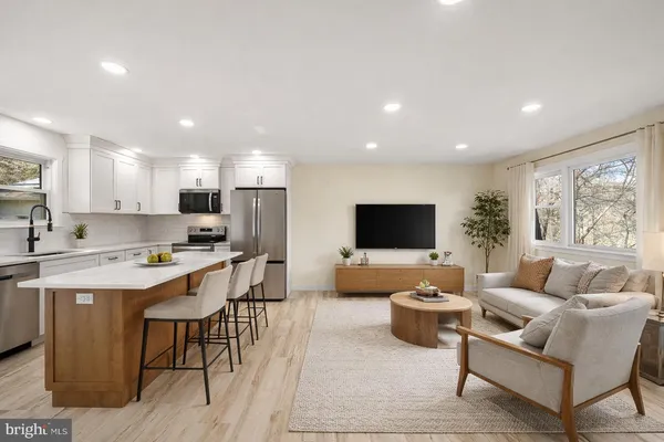a living room with lots of furniture and a flat screen tv