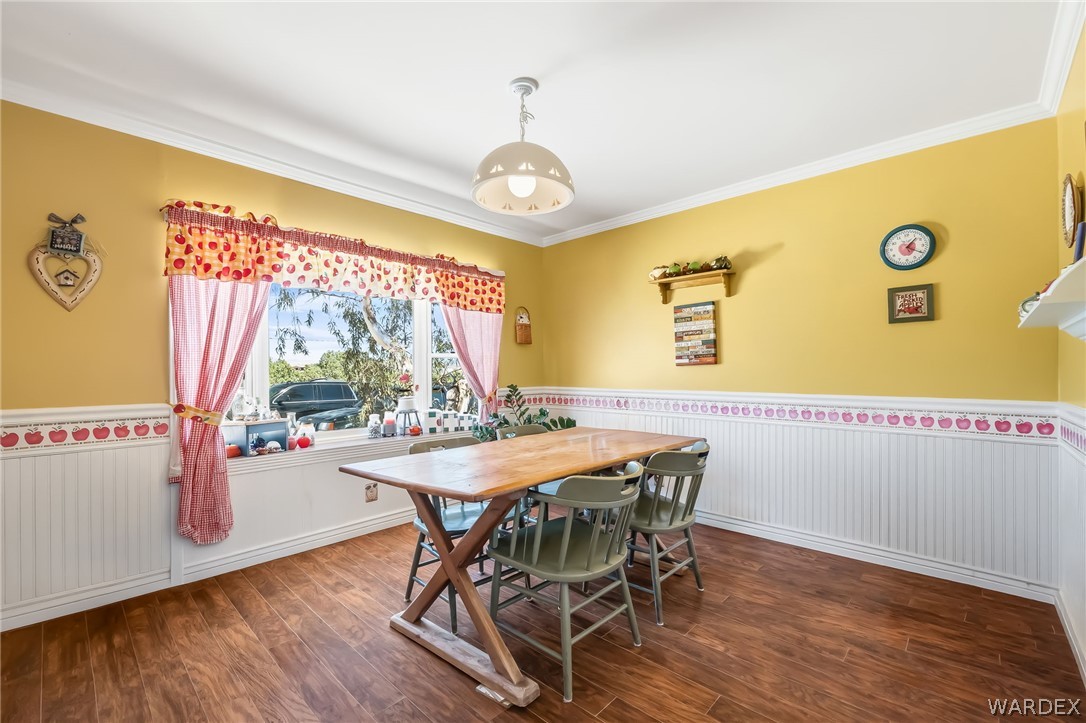 2401 North Stephan Road Kingman, AZ 86401 - Photo 35 of 92 a view of a dining room with furniture window and wooden floor