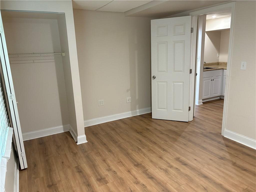 4747 Julian Way Acworth, GA 30101 - Photo 18 of 27 an empty room with wooden floor