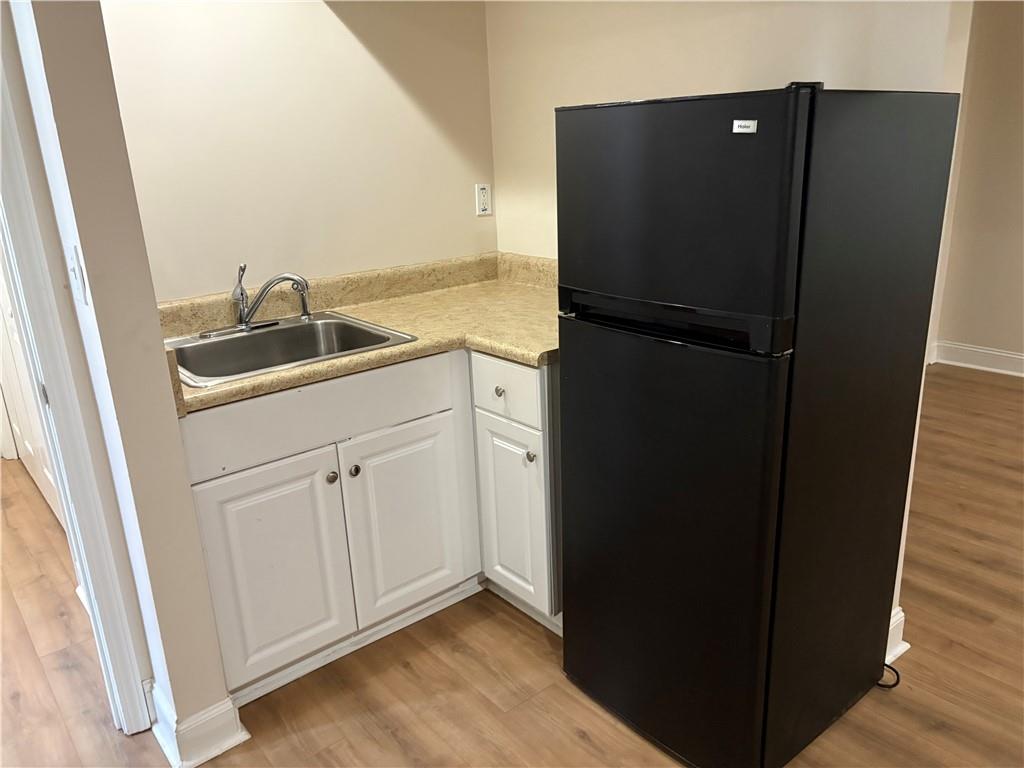 4747 Julian Way Acworth, GA 30101 - Photo 20 of 27 a kitchen with a sink and refrigerator