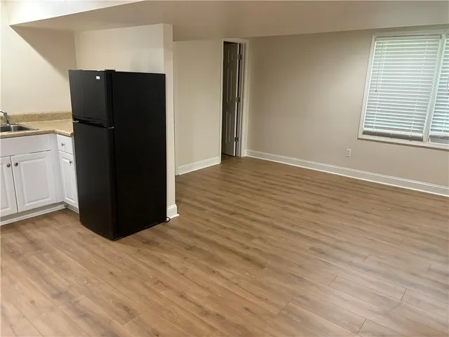 an empty room with wooden floor