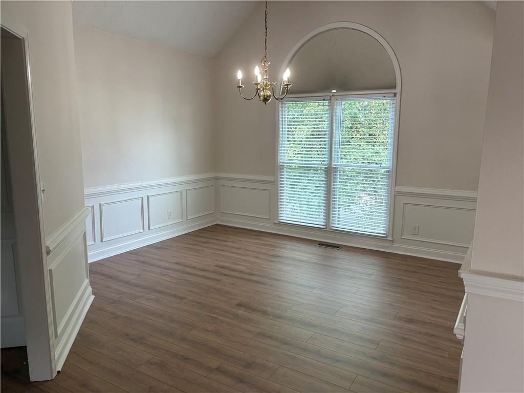 4747 Julian Way Acworth, GA 30101 - Photo 7 of 27 an empty room with wooden floor and windows