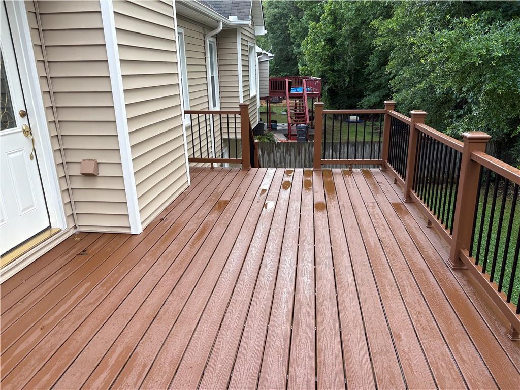 4747 Julian Way Acworth, GA 30101 - Photo 8 of 27 a view of balcony with wooden floor and fence