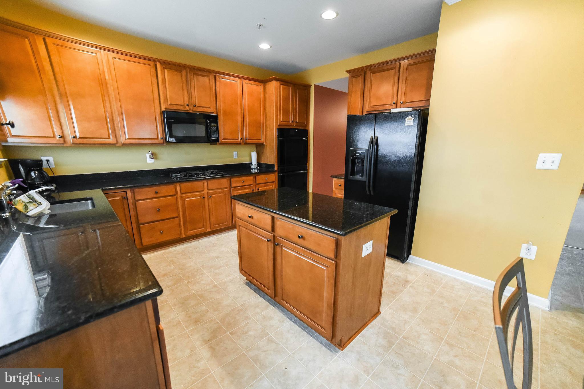 15319 Pulaski Road Brandywine, MD 20613 - Photo 3 of 30 Kitchen with granite counter tops & island.