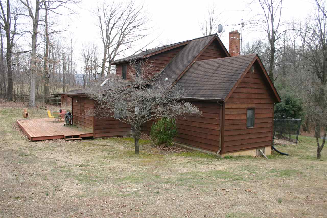 3335 Beulah Road Keezletown, VA 22832 - Photo 13 of 24 a view of a house with a yard and wooden fence