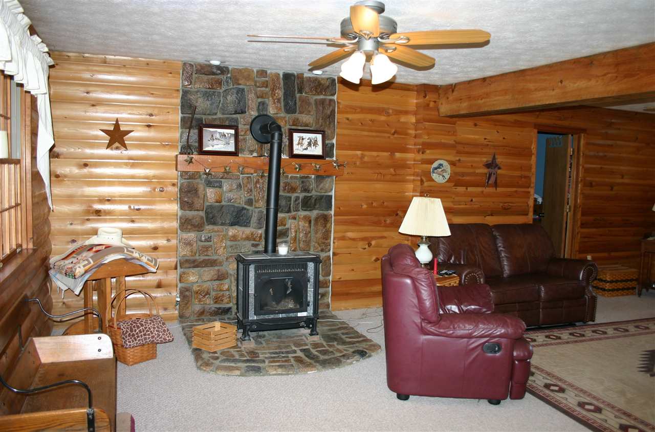 3335 Beulah Road Keezletown, VA 22832 - Photo 15 of 24 a living room with fireplace furniture and a flat screen tv