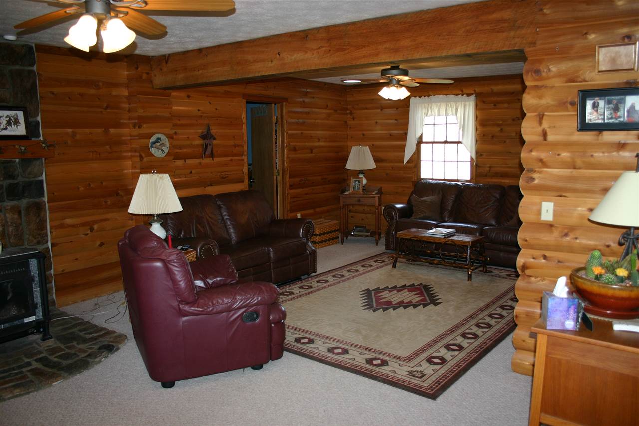 3335 Beulah Road Keezletown, VA 22832 - Photo 16 of 24 a living room with furniture and a fireplace