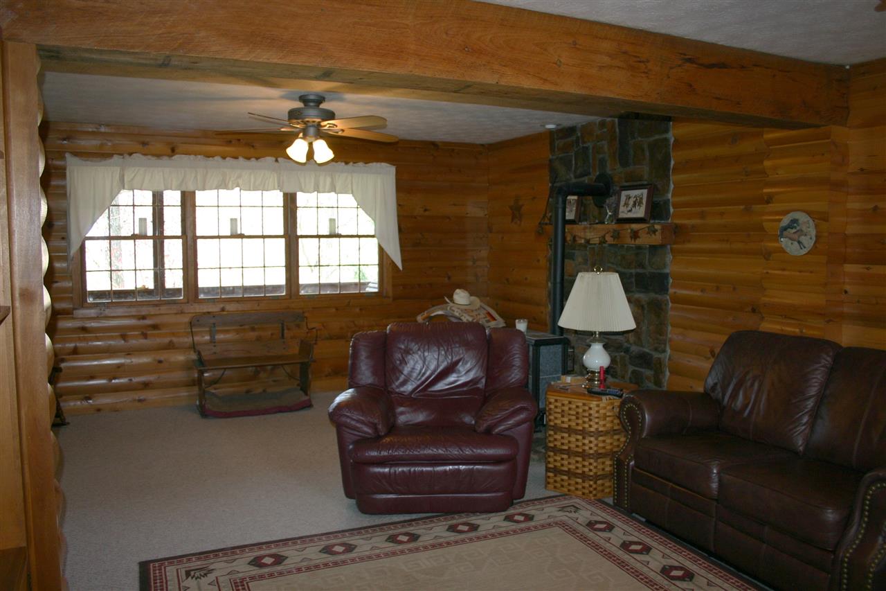 3335 Beulah Road Keezletown, VA 22832 - Photo 17 of 24 a living room with furniture and a fireplace