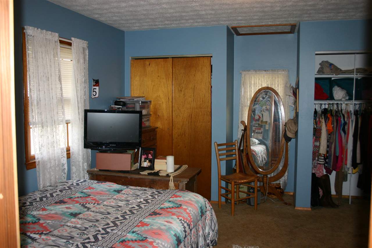 3335 Beulah Road Keezletown, VA 22832 - Photo 18 of 24 a bedroom with a bed and a flat screen tv