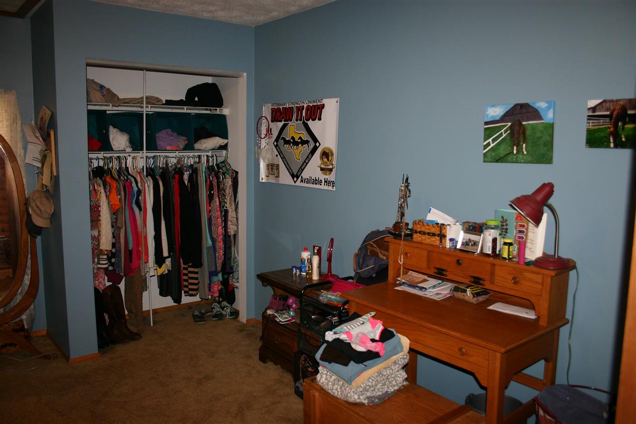 3335 Beulah Road Keezletown, VA 22832 - Photo 19 of 24 a living room with lots of furniture and clothes