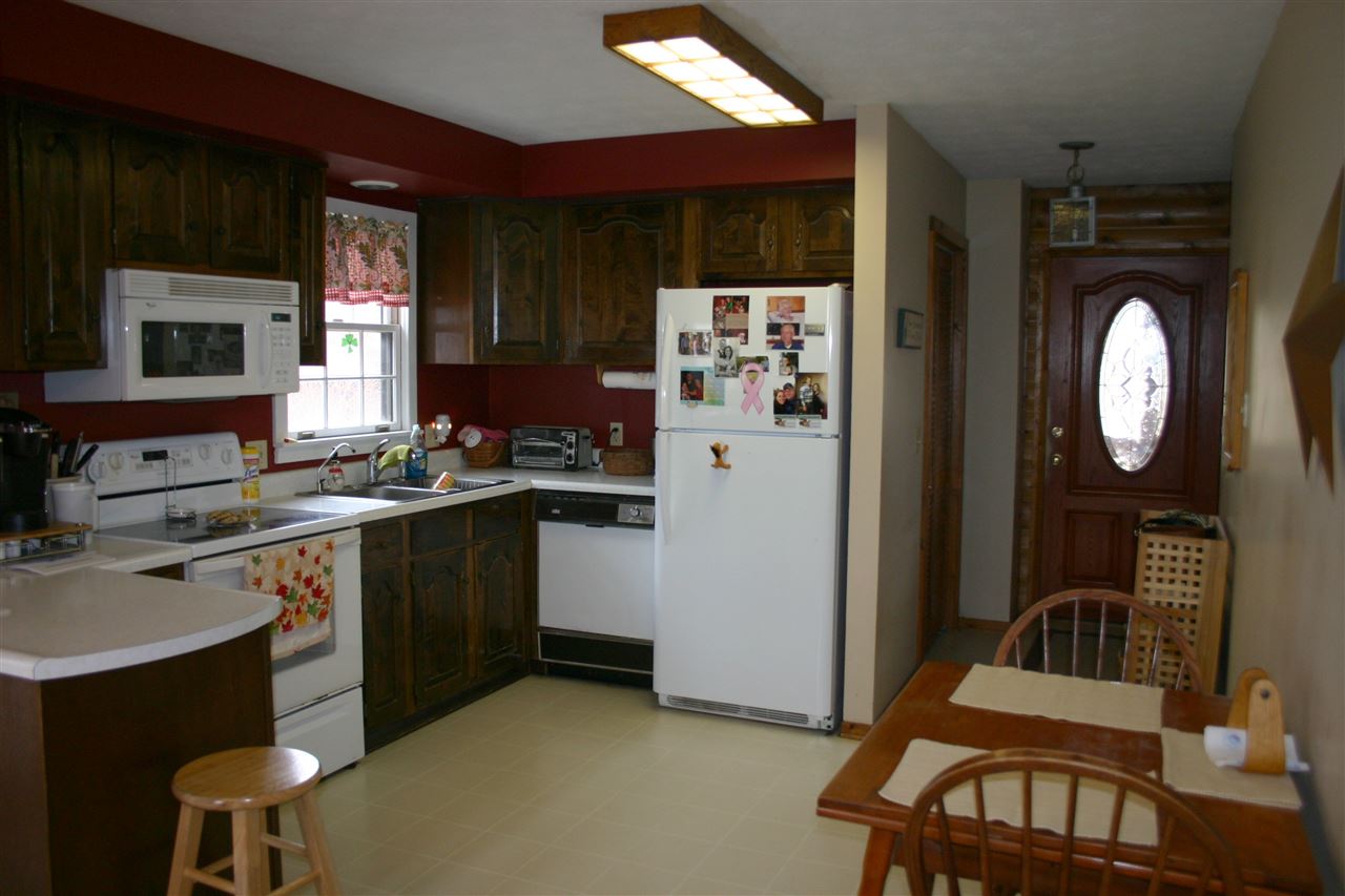 3335 Beulah Road Keezletown, VA 22832 - Photo 5 of 24 a kitchen with a sink appliances and cabinets