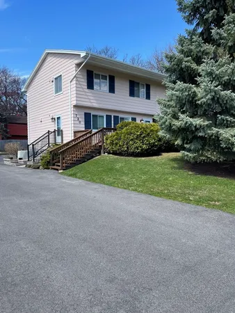a front view of a house with a yard