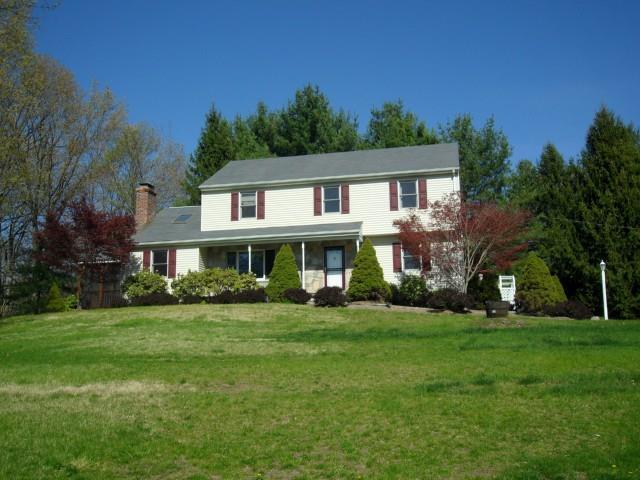 28 Sarah Bishop Road Ridgefield, CT 06877 - Photo 1 of 1 a front view of a house with a garden