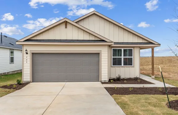 a front view of a house with a garage