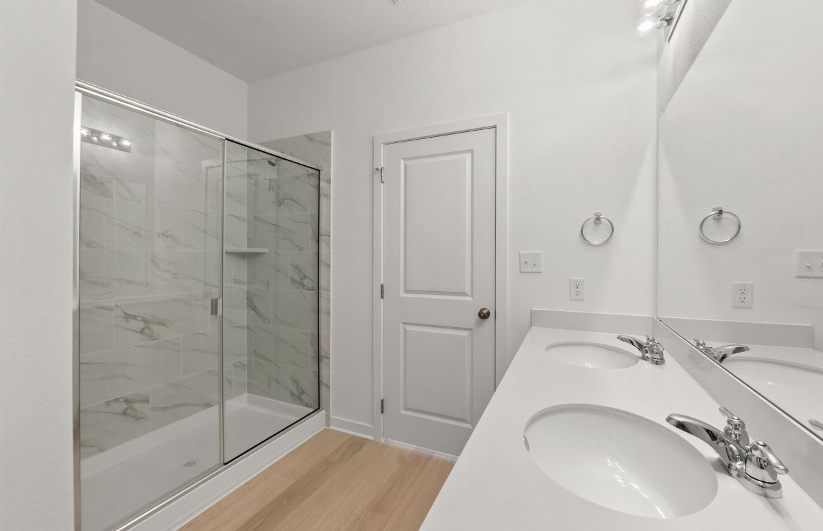 408 Sullivan Way Elgin, TX 78621 - Photo 15 of 22 a bathroom with a sink and a mirror