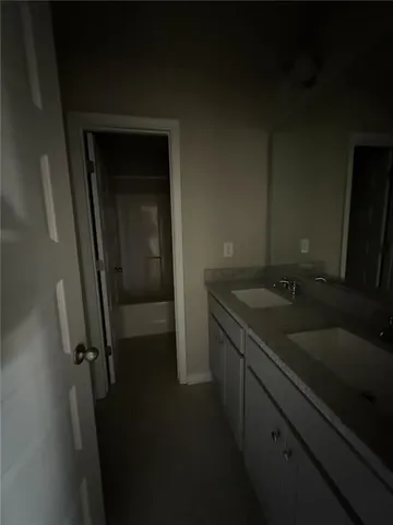 a bathroom with a sink and mirror