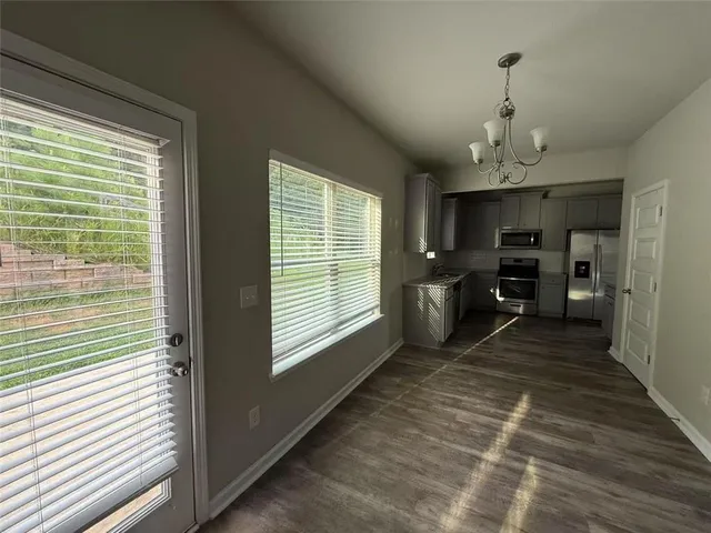 a room with furniture and a large window