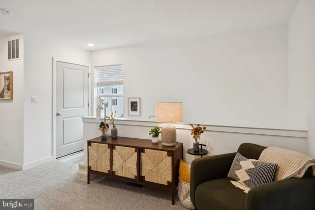 a bedroom with furniture and a lamp